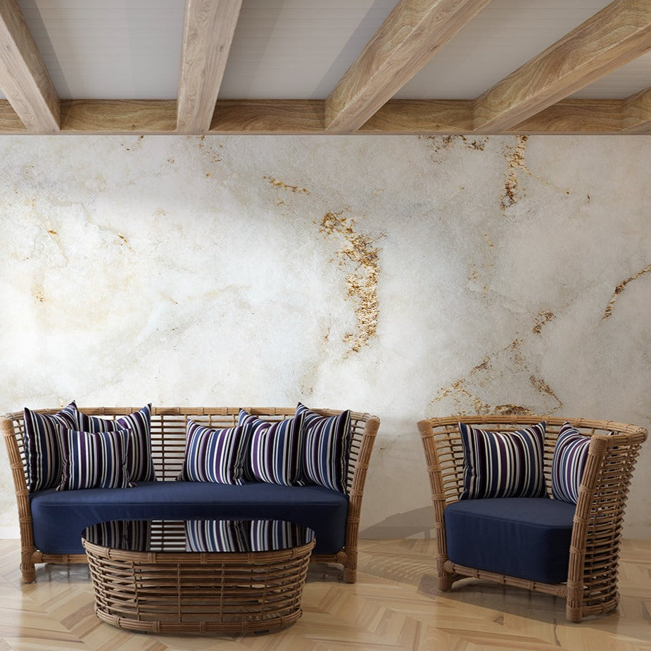 White and gold marble wallpaper in modern living room with high ceilings and natural light