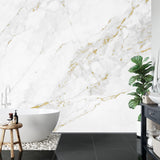 White marble wallpaper with gold accents in minimalist dining room