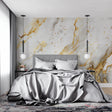 White and gold marble wallpaper in modern living room with natural light highlighting the golden veins