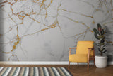 Luxury marble wall mural in master bedroom with gold accents