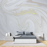 White and gold marble effect wallpaper in a bright dining room