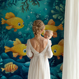 Fish mural wallpaper making a statement in a child's study area with bright sea elements