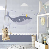 Ocean whale wallpaper transforming a kids bedroom with soft gray and white tones