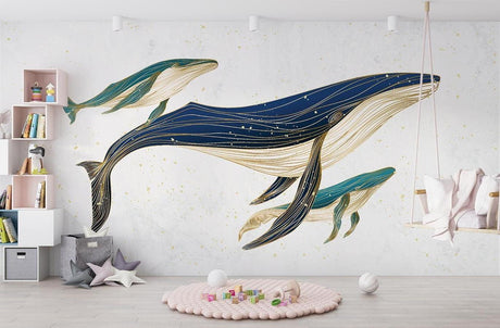 Marine life wallpaper featuring whales in navy and gold, displayed in a modern nursery with soft lighting