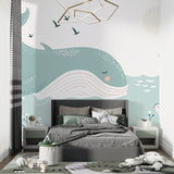 Marine animals wallpaper showcased in a bright nursery with white furniture and natural light