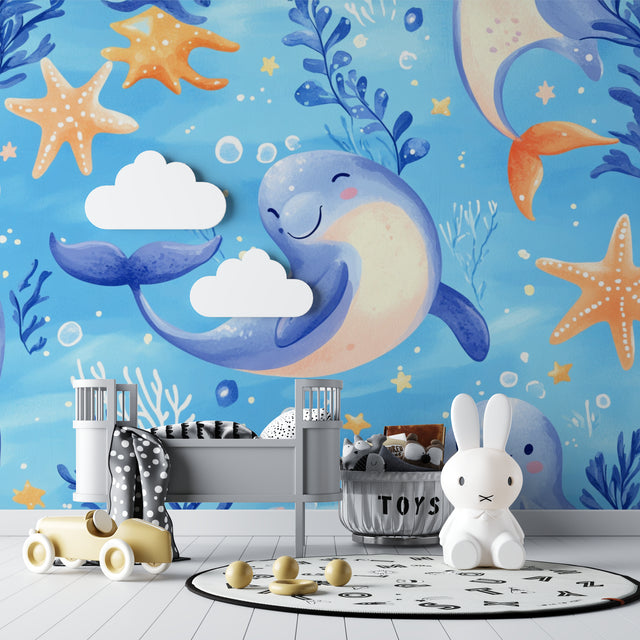 Marine animals wallpaper creating a magical underwater scene in a modern nursery with white furniture