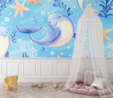 Ocean theme wallpaper brightening a kid's bedroom with playful sea creatures