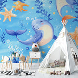 Marine mural bringing ocean magic to a baby's nursery with gentle lighting