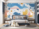Marine animals wallpaper in bright kids bedroom showing playful whales and coral design