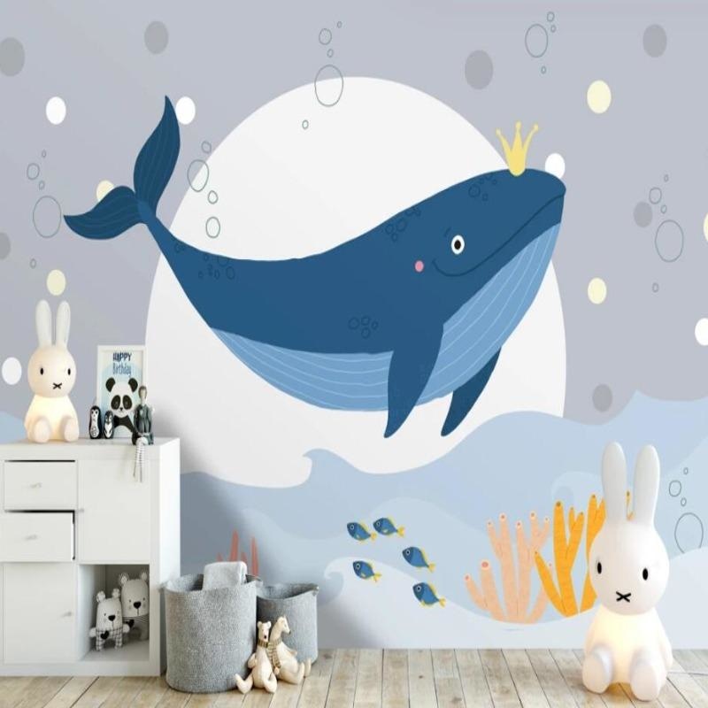 Marine animals wallpaper with royal whale shown in bright kids bedroom, creating a playful ocean theme atmosphere