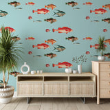 Marine life wallpaper creating an underwater scene in a modern bathroom, with tropical fish swimming against aqua blue background