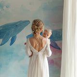 Whale wallpaper mural creating a peaceful atmosphere in a children's bedroom