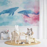 Whale wall mural creating depth in a playroom with soft pastel colors