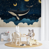 Starry whale wallpaper creating dreamy atmosphere in baby room