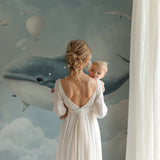 Marine animals wallpaper in modern nursery with white furniture and soft lighting