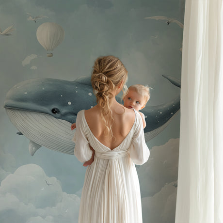 Marine animals wallpaper in modern nursery with white furniture and soft lighting