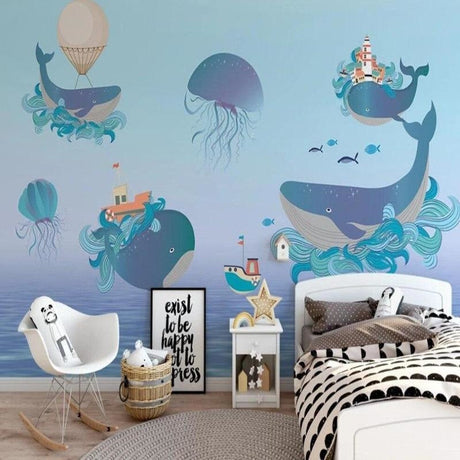 Marine life wallpaper creating a magical atmosphere in a modern nursery with floating whales and jellyfish