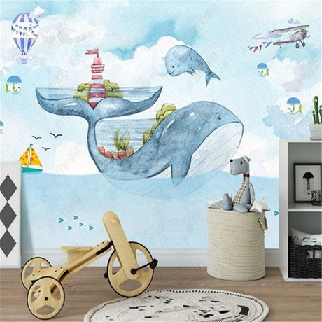 Marine whale wallpaper mural styled in a cozy nursery with wooden furniture and soft lighting
