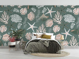 Seashell wallpaper in sage green adding coastal charm to a living room accent wall