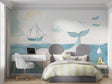Ocean theme wallpaper with whale and sailboat creating a peaceful atmosphere in a modern nursery