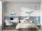 Ocean theme wallpaper with whale and sailboat creating a peaceful atmosphere in a modern nursery