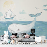 Whale wall mural bringing maritime charm to a cozy kids bedroom