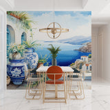 Mediterranean coastal wallpaper creating a bright, airy atmosphere in a modern living room with white furniture