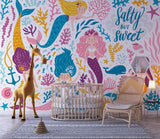 Mermaid wallpaper creating a whimsical atmosphere in a girl's reading nook