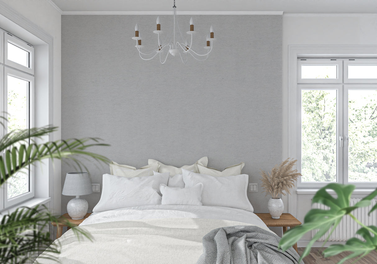 Grey minimalist wallpaper in modern home office with natural lighting