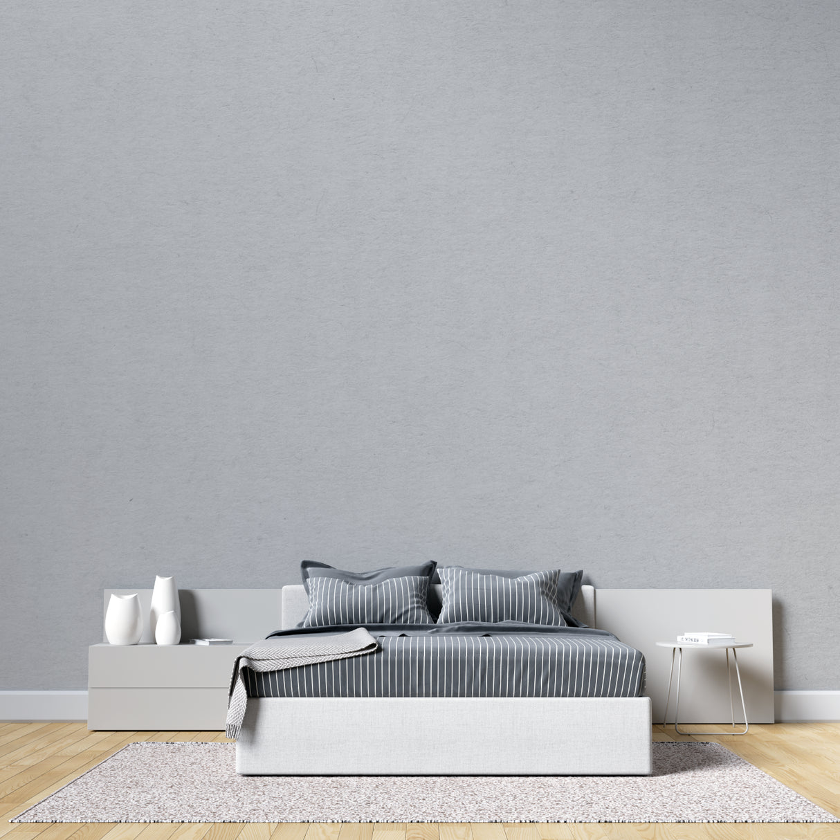 Modern grey wall covering in master bedroom creating serene atmosphere