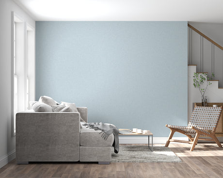 Powder blue minimalist wallpaper in modern living room with natural light streaming through windows