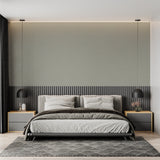 Minimalist sage green wallpaper creating a serene atmosphere in a contemporary bedroom setting