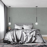Textured sage grey wallpaper in hallway showing seamless application