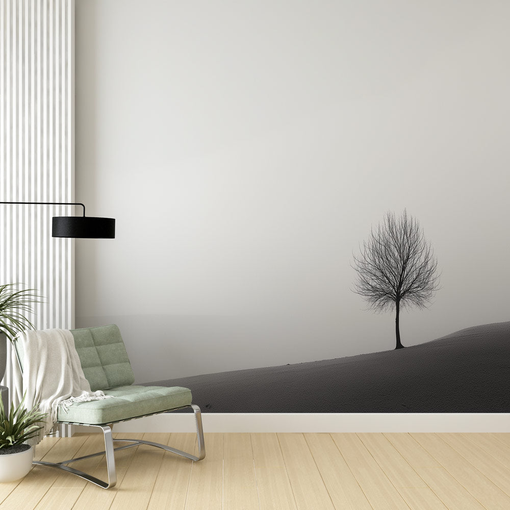 Minimalist tree wallpaper creating a serene atmosphere in a modern living room with clean lines and minimal furniture