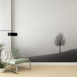 Minimalist tree wallpaper creating a serene atmosphere in a modern living room with clean lines and minimal furniture