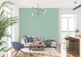 Peaceful mint green wall mural in minimalist bedroom setting