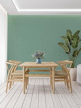 Modern mint green wall design in dining room with white furniture
