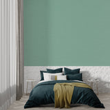Solid mint green wallpaper in nursery showing calming effect