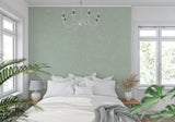 Mint green wall covering in a dining room showcasing its versatility with different furniture styles