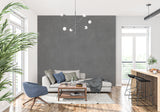 Charcoal grey mural wallpaper creating depth in minimal dining room setting