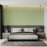 Sage green minimalist wall mural creating calm in a modern home office space