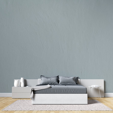 Sage green textured wallpaper in modern living room with natural light highlighting subtle pattern