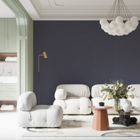 Modern grey wallpaper creating a sophisticated living room with leather sofa and minimalist decor