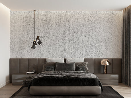 Modern speckled grey wallpaper in a bright living room setting with minimalist furniture