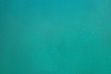 Teal green minimalist design file showing smooth color and texture pattern