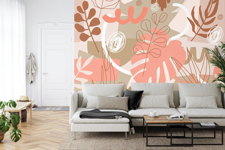 Modern living room with Monstera leaf wallpaper in coral and beige tones, creating a fresh botanical atmosphere