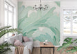 Modern living room with Monstera leaf wallpaper in mint green, showing flowing abstract botanical pattern
