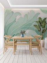 Home office featuring mint green Monstera leaf mural creating a fresh workspace atmosphere