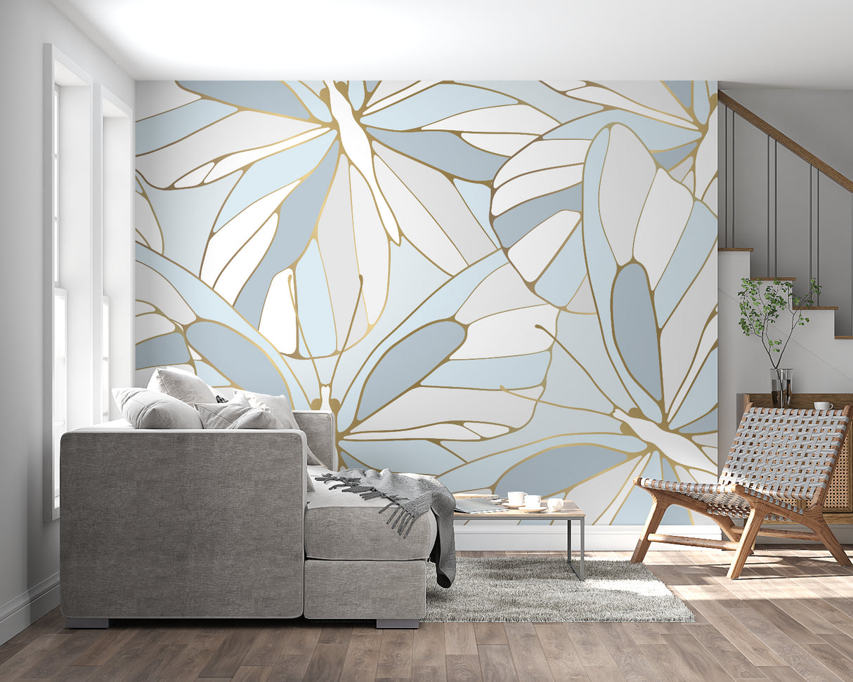 Home office space with tropical leaf wallpaper in sophisticated blue and gold tones