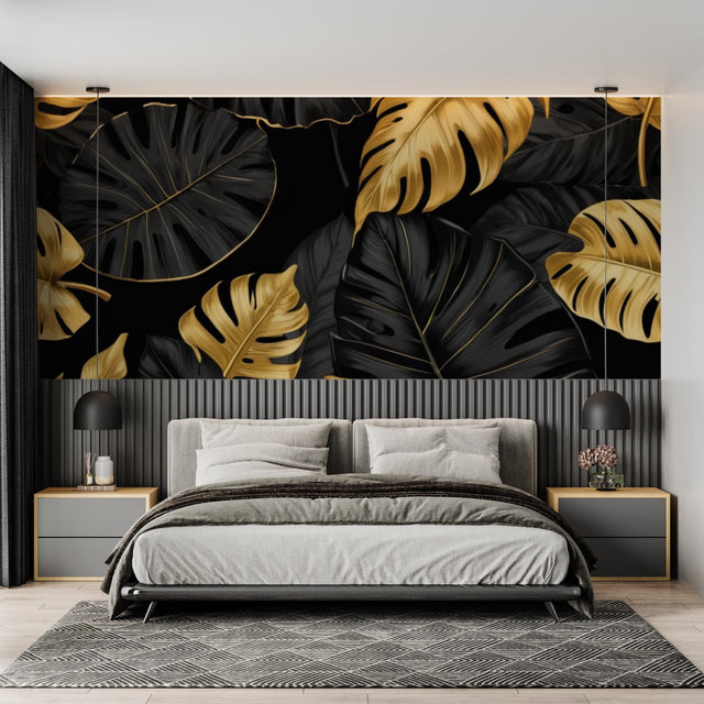 Monstera leaf wallpaper in black and gold creating drama in a modern living room with tall windows